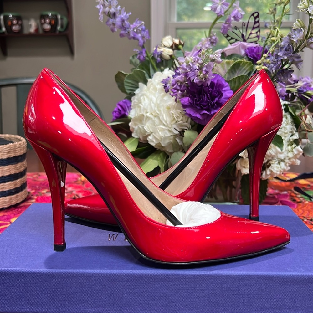 Stuart Weitzman red heels. Used-new condition. Includes box.